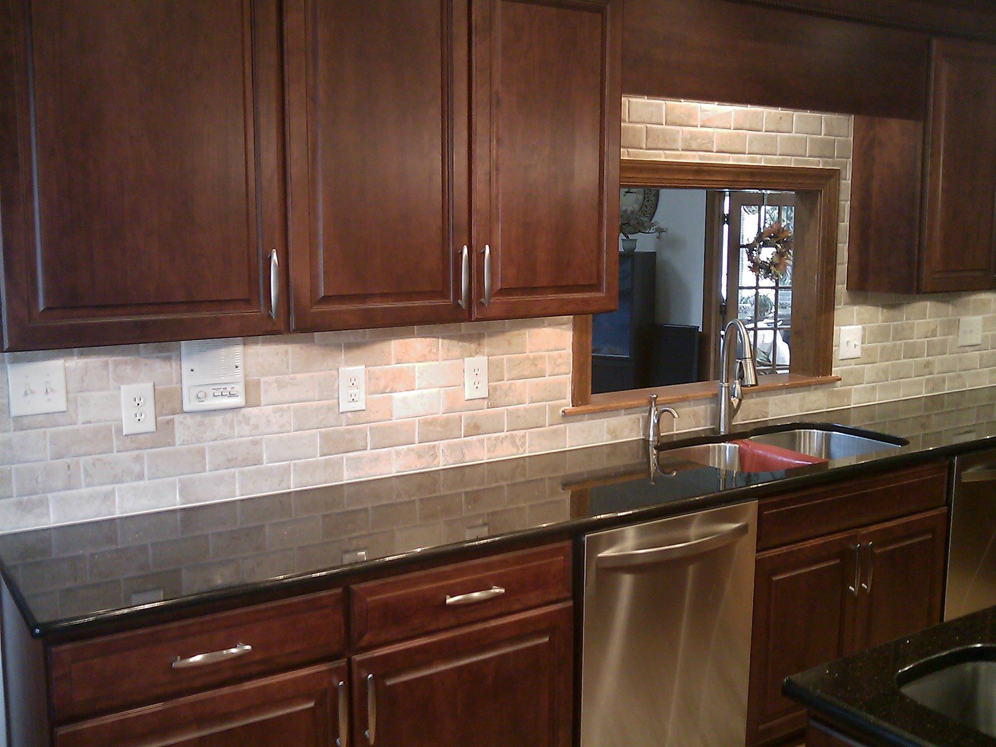 Kitchen Dark Cabinets and Brick Backsplash